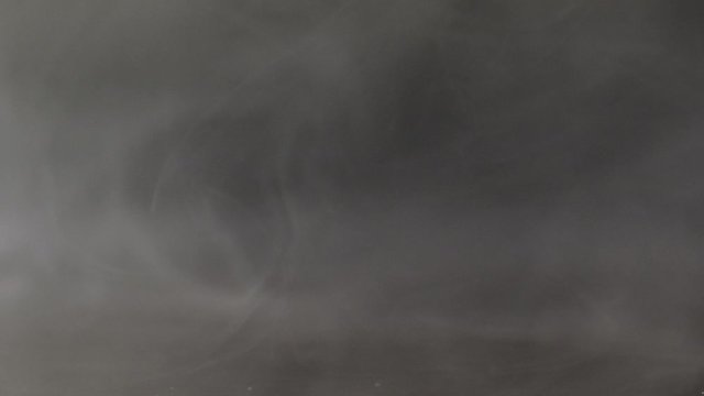 Smoke on black background, slow motion flow backgrounds