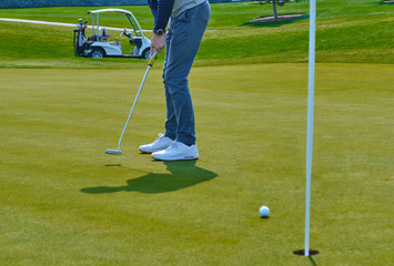 young man playing golf