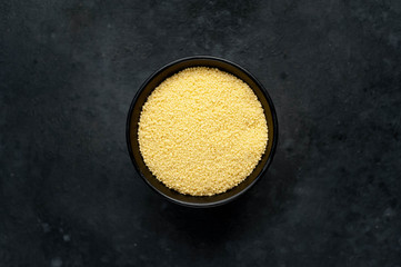 couscous in a bowl on a stone background