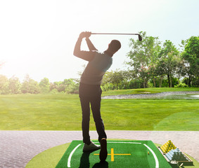 young man playing golf