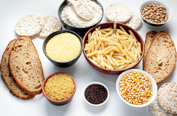 Selection of gluten free food. Chickpeas, bread, couscous, bulgur, pasta, bread, flour, quinoa on a white background, isolated