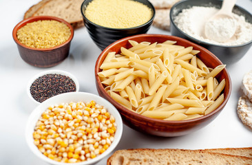 Selection of gluten free food. Chickpeas, bread, couscous, bulgur, pasta, bread, flour, quinoa on a white background, isolated
