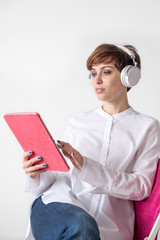 Online education. self-education. girl is listening to music. Audio book. girl listens to e-book.