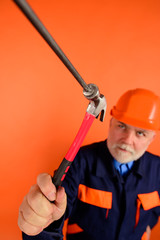 Hammering nails.Hammer and nails. Repairment tools. Builder. Worker. Worker hammers nails. Repair man. Engineer. Hard hat. Selective focus. Advertising.