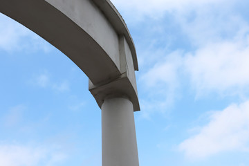 Part of the white arch against the sky
