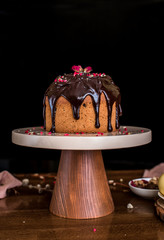Easter cake on a beautiful stand with chocolate glaze