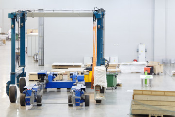 Industrial forklift inside a high hangar.