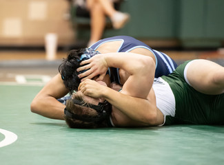High School boys wrestling in a competitive match