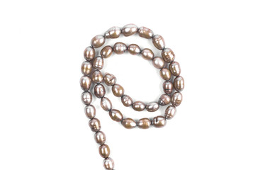Brown pearl beads isolated on a white background