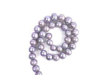 Pink pearl beads isolated on a white background