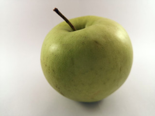 Ripe, juicy green apple on a white background, isolate