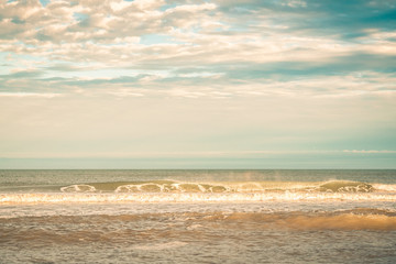 Afternoon Shining Golden on Curling Ocean Waves