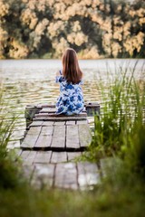 girl sitting on a bench in the park