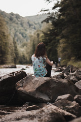 girl on a rock in the mountains