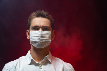 The doctor shows that it is necessary to use a respiratory mask in an epidemic. copy space