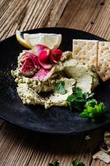 Green hummus with pickled watermelon radishes