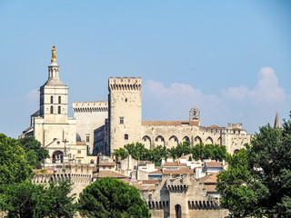 Fototapeta na wymiar Palais des Papes or Palace of the Popes dominates the skyline of Avignon, France.