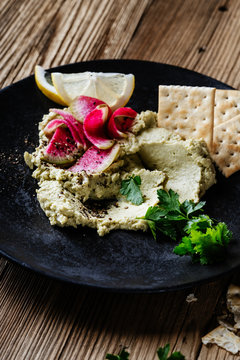 Green hummus with pickled watermelon radishes