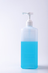 Clear hand sanitizer in a clear pump bottle isolated on a white background. Hand sanitizer is used for killing germs, bacteria and viruses