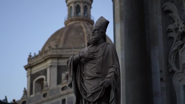 Statue in Cathedral Sant Agata on Piazza del Duomo in Catania, Sicily, Italy. Summer tourism landmark & family travel destination in Europe. Italian culture. Visit Italy.