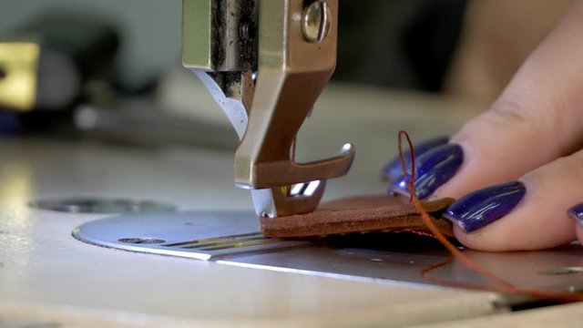 Fast Sewing machine close up - leather strap making