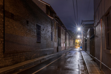 wet narrow street at night
