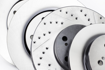 several different types of brake discs on a white background