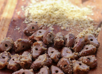 Chicken heart made on skewers, traditional food on barbecue.