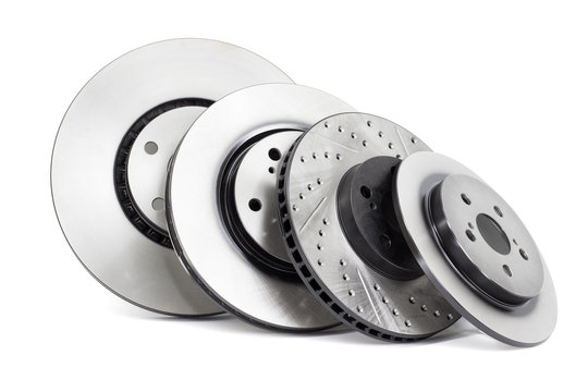 several different types of brake discs on a white background