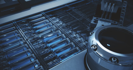 Pharmaceutical manufacturing line. Cardboard automatic factory packaging machine for packaging ampoules with vaccine and medicines. Cold shade filter