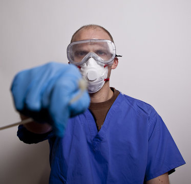 doctor in medical mask taking swob