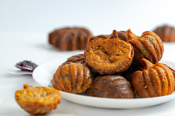 Baked mini butter mochi cake in maple leaf and pumpkin shape, crisp on the outside and chewy on the inside