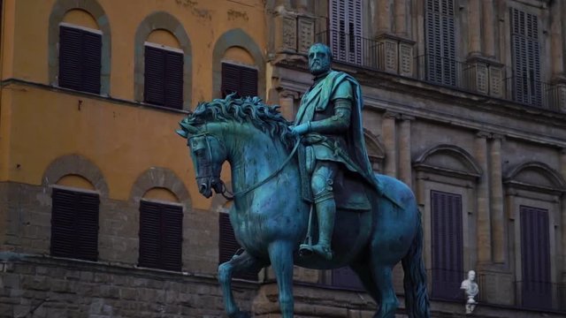 Equestrian Monument of Cosimo I statue in Piazza della Signoria, main square in Florence, Italy. Historic tourist attraction of Tuscany, Italy. Summer tourism & family travel destination in Europe.