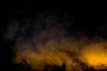yellow smoke isolated on black background