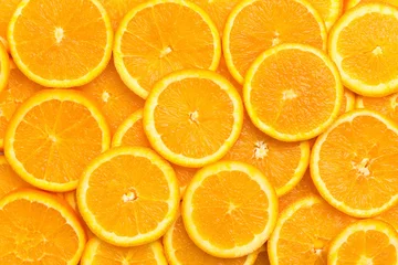 Poster Full frame of fresh orange fruit slices pattern background, close up, high angle view © respiro888