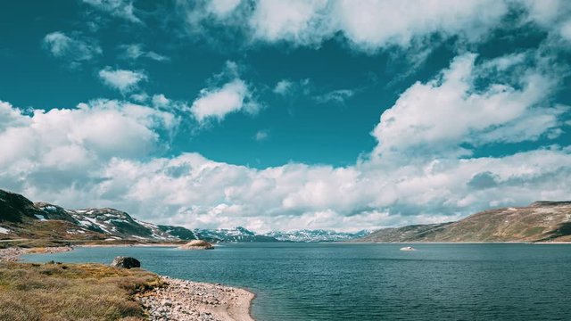 Oppland, Tyin Lake, Norway. Stones On Coast Of Beautiful Lake Tyin In Summer Day. Norwegian Nature. 4K