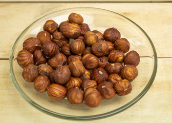 Kernels in a glass plate on a wooden background