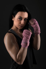 sexy girl training in the gym engaged in boxing