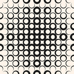 Vector geometric halftone seamless pattern with circles, rings, dots. Abstract texture in black and white colors. Background with radial gradient transition. Trendy modern design for decor, digital