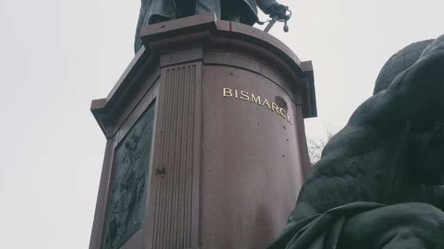 Traces of shrapnel WW2 on basis of monument to Bismarck, under letters of name