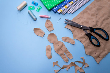Do it yourself. Hand made picture for background. We sew a rabbit. Toy pattern. Materials for needlework.