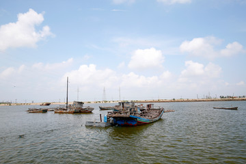 The fishing boat docked at the wharf