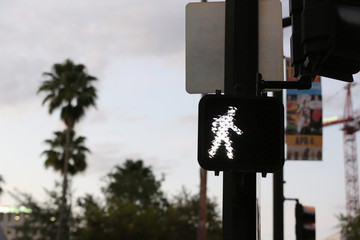 digital walk sign at the cross walk