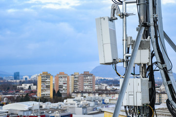 5G new radio telecommunication network antenna mounted on a metal pole providing strong signal...