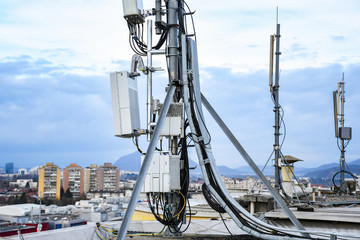5G new radio telecommunication network antenna mounted on a metal pole providing strong signal waves 