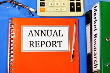 Annual report-expresses a reliable opinion of the correctness of the company's activities and its assessment. There are folders with accounting documents on the Manager's Desk.