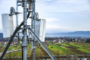 5G new radio telecommunication network antenna mounted on a metal pole providing strong signal...