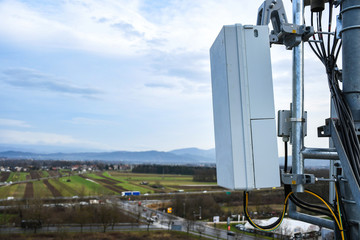5G new radio telecommunication network antenna mounted on a metal pole providing strong signal...