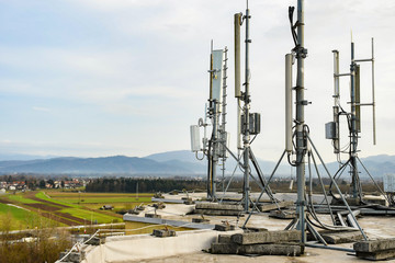 Cellular radio telecommunication network antenna mounted on a metal pole providing strong signal...