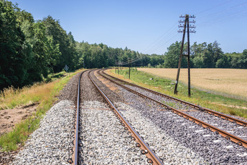 Fototapeta na wymiar Railroad tracks near Czaplinek town in West Pomeranian Voivodeship of Poland